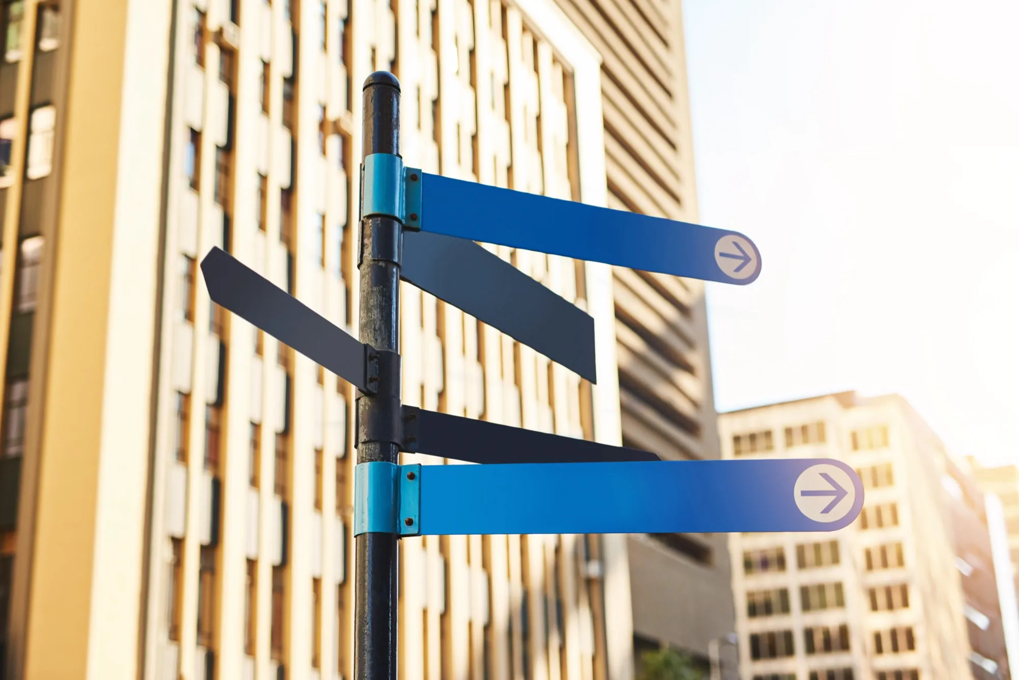 Blue directional signage pointing the way